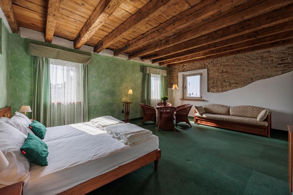 Postel nebo postele na pokoji v ubytování Hotel alla Grotta