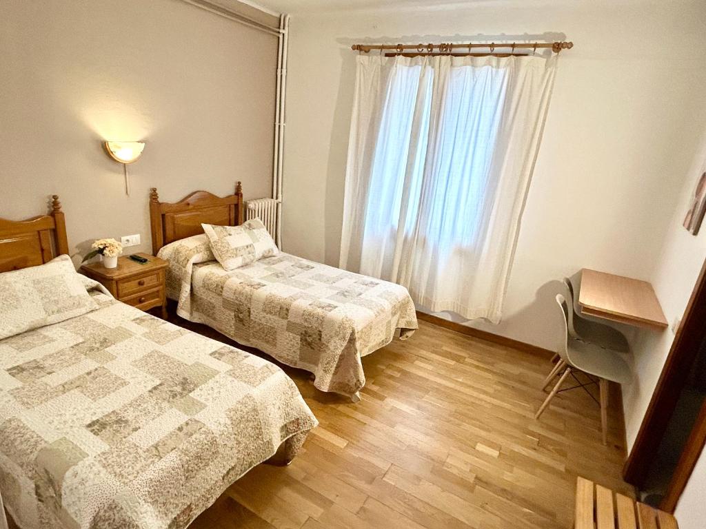 Postel nebo postele na pokoji v ubytování Hostal Estació
