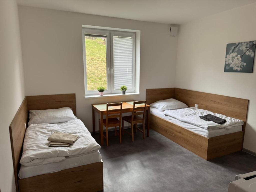 Postel nebo postele na pokoji v ubytování Ubytování U Potoka