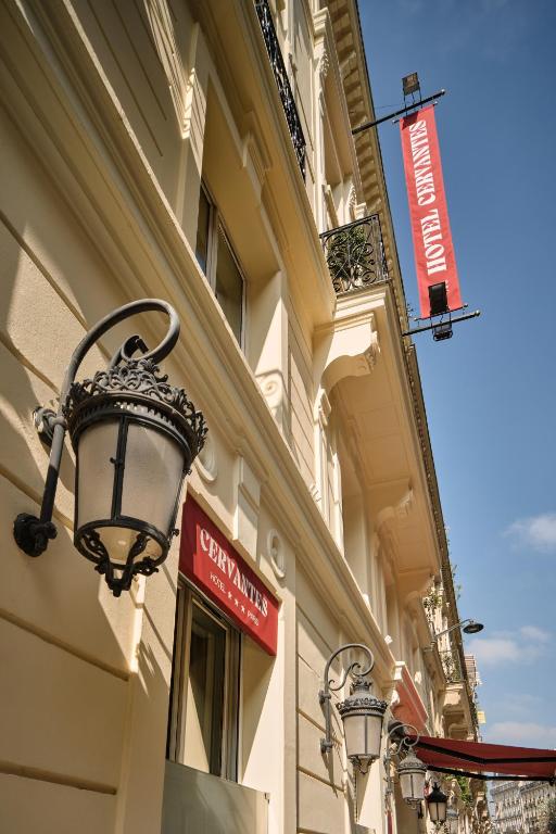 a street light on the side of a building at Hotel Cervantes by Happyculture in Paris