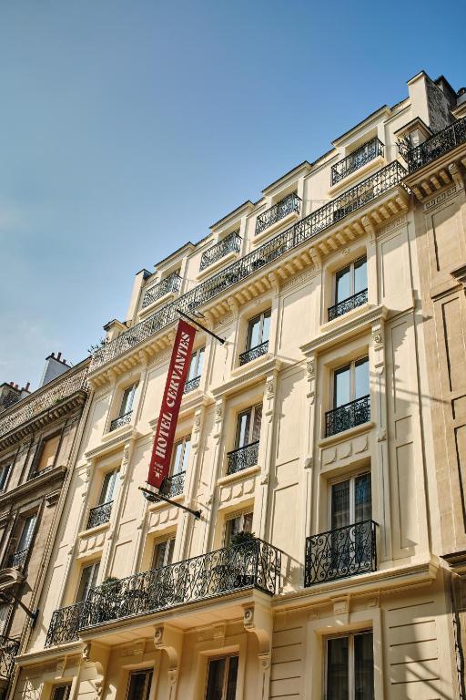 a building with a sign on the side of it at Hotel Cervantes by Happyculture in Paris