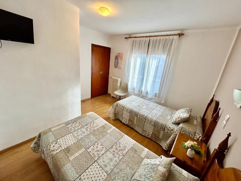 Postel nebo postele na pokoji v ubytování Hostal Estació