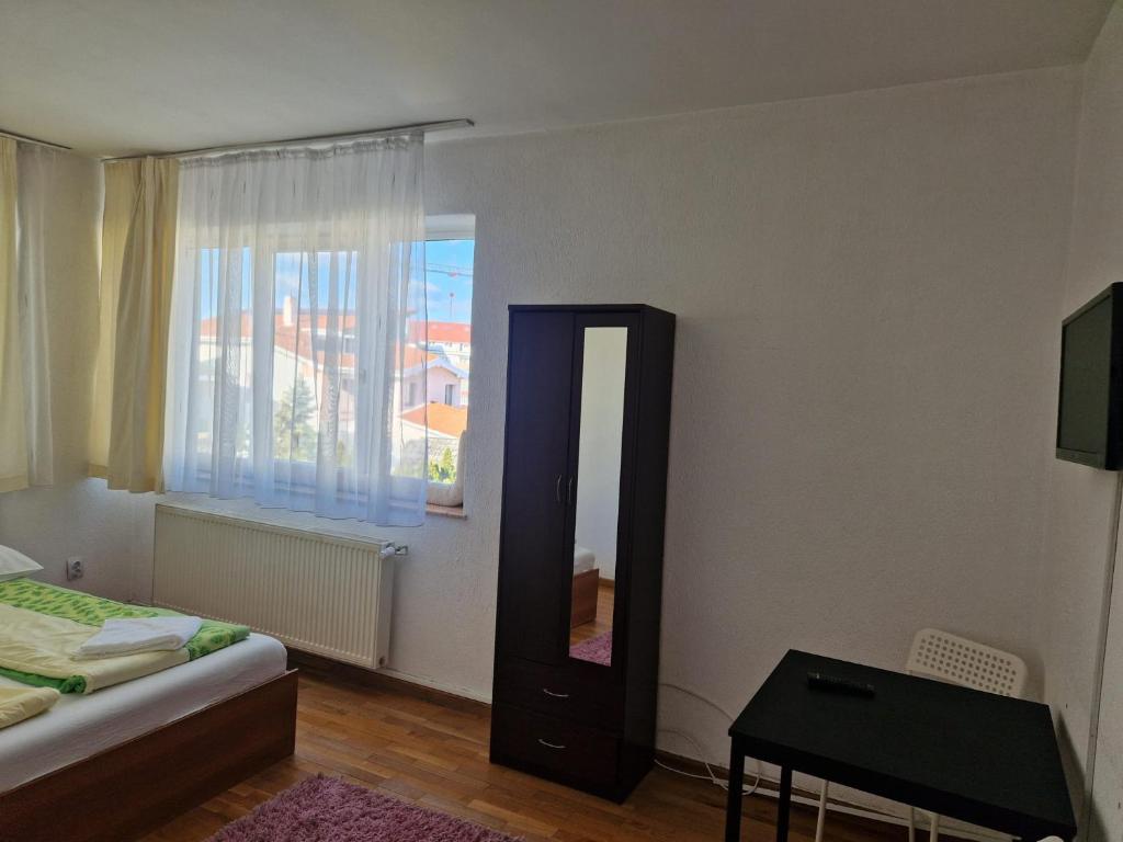 Postel nebo postele na pokoji v ubytování BigCitty Rooms