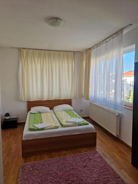 Postel nebo postele na pokoji v ubytování BigCitty Rooms
