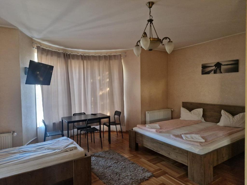 Postel nebo postele na pokoji v ubytování BigCitty Rooms