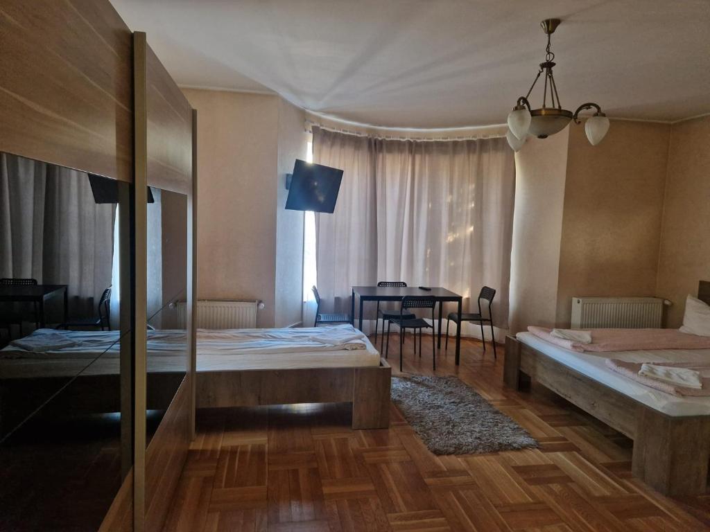 Postel nebo postele na pokoji v ubytování BigCitty Rooms