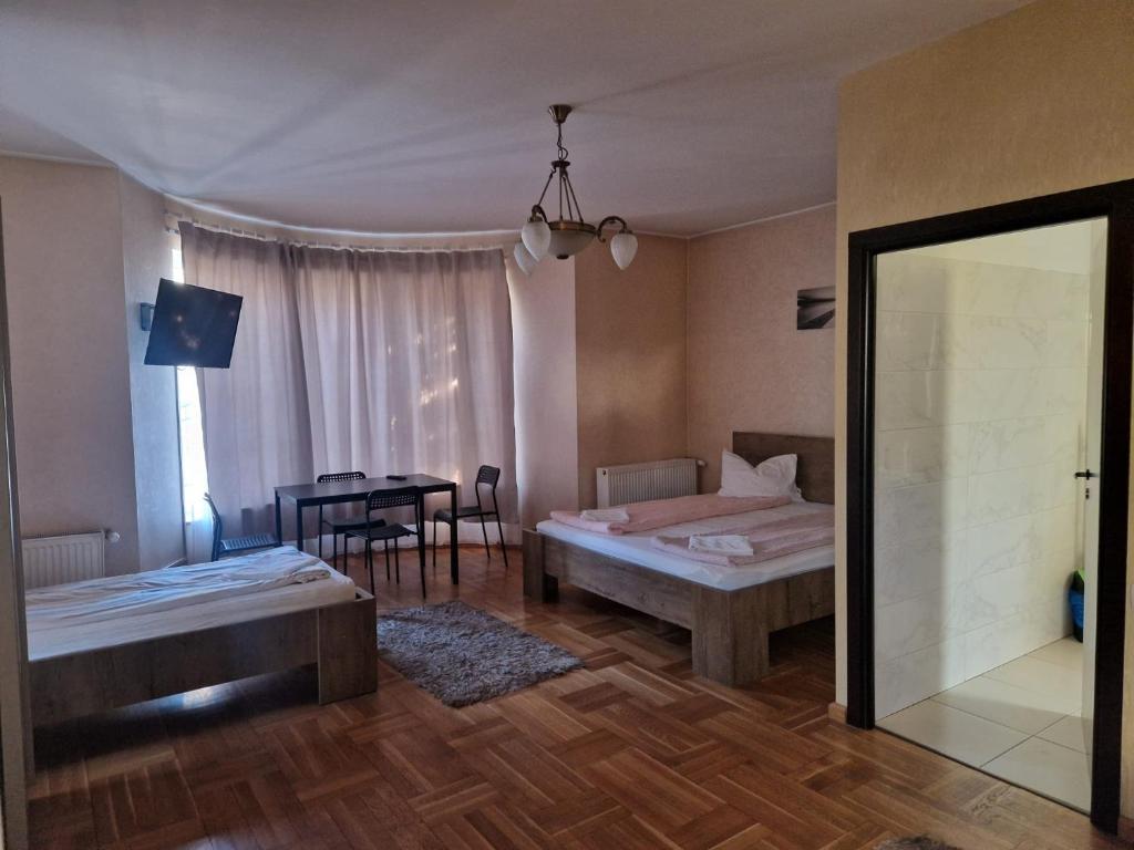 Postel nebo postele na pokoji v ubytování BigCitty Rooms