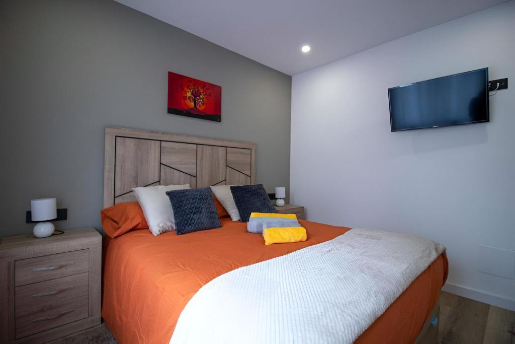 Katil atau katil-katil dalam bilik di Apartamento Moderno a 5 min del Funicamp, 1-2