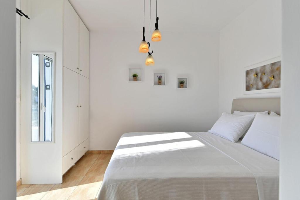 Posteľ alebo postele v izbe v ubytovaní DreamCatcher Sea view mini pool Paros