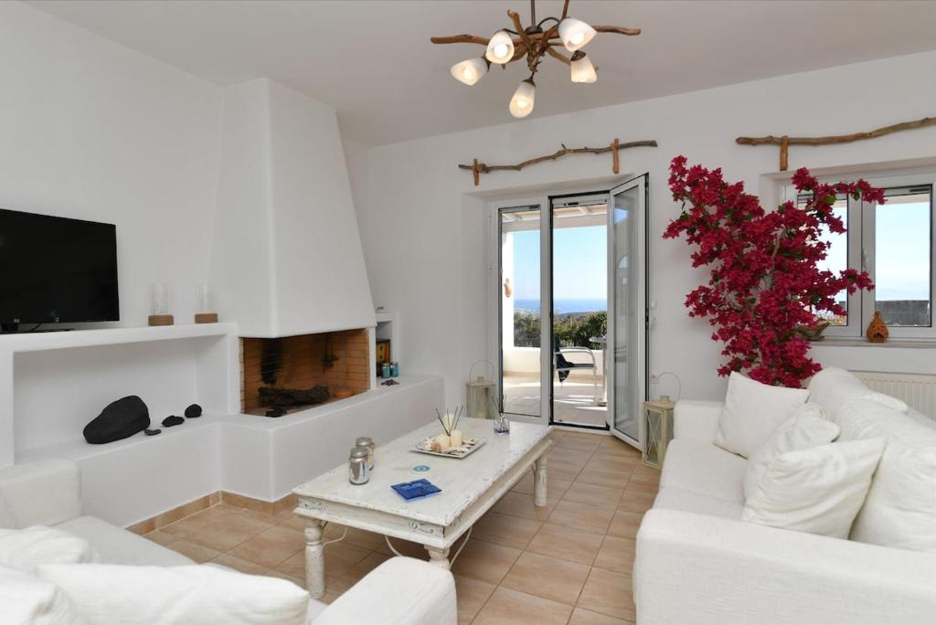 Televízia a/alebo spoločenská miestnosť v ubytovaní DreamCatcher Sea view mini pool Paros