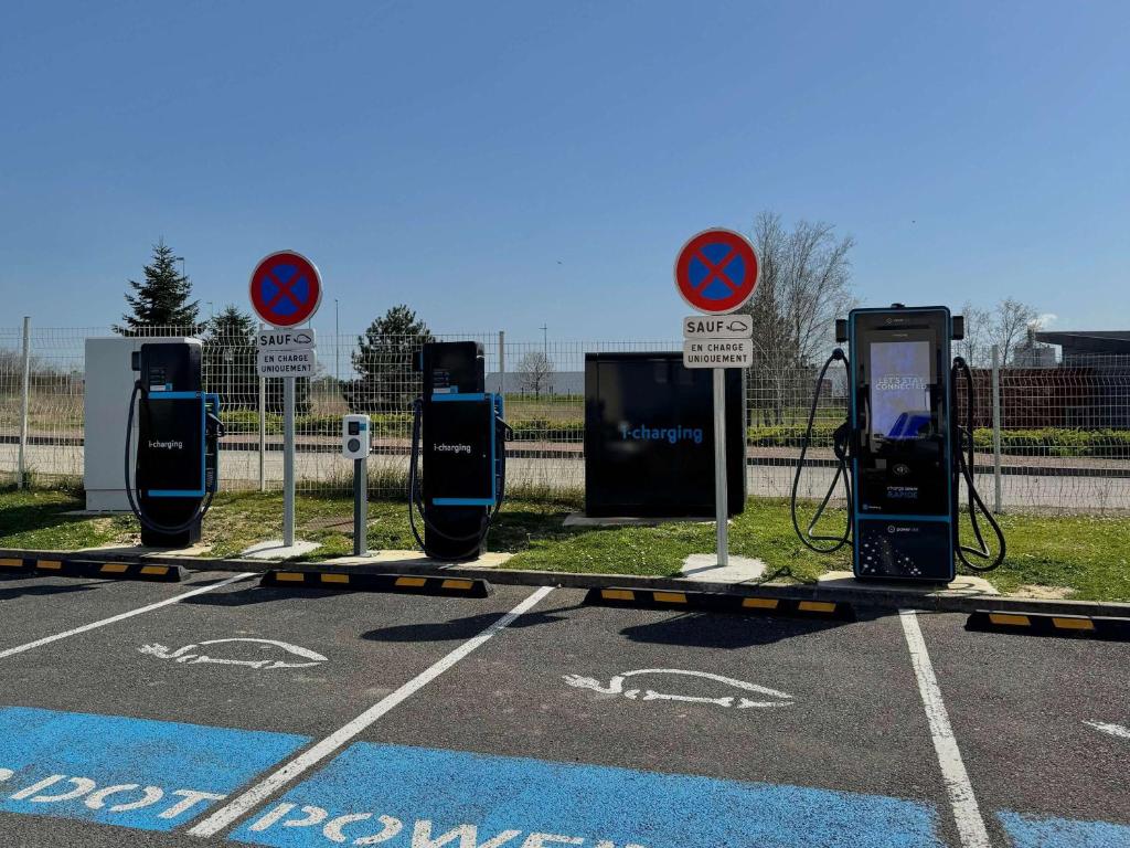 a row of gas pumps in a parking lot at Hotel Ibis Budget Cosne Sur Loire in Cosne-Cours-sur-Loire
