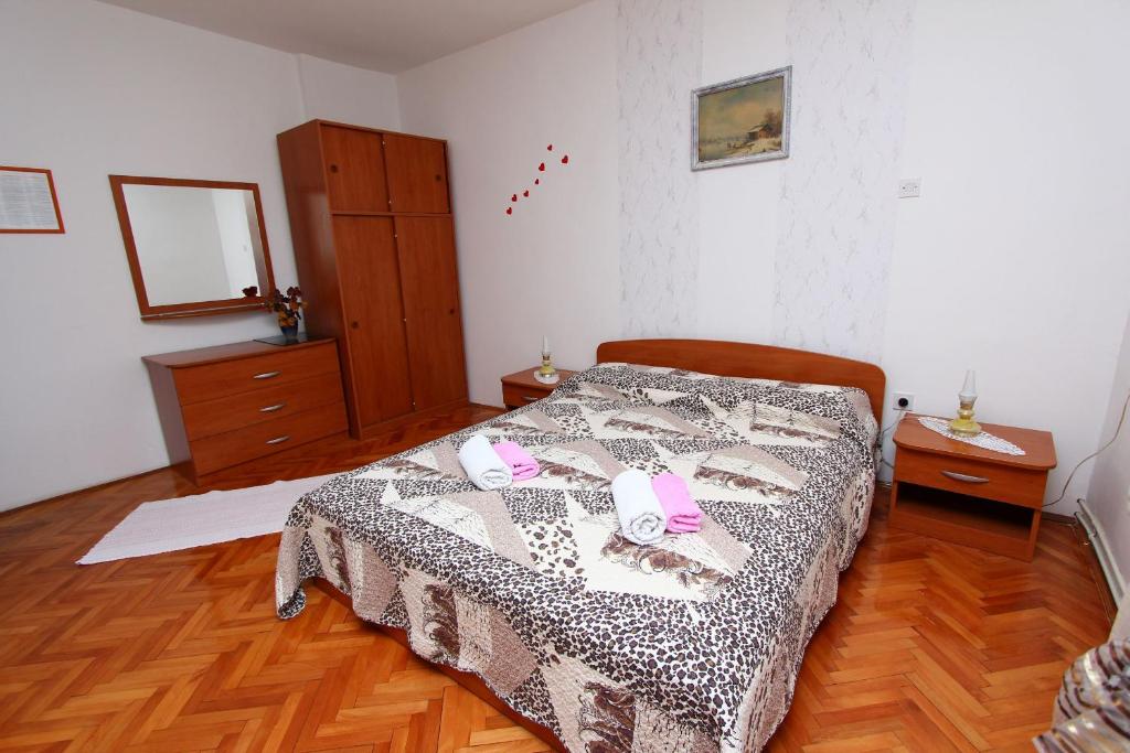 Postel nebo postele na pokoji v ubytování Apartments Goga