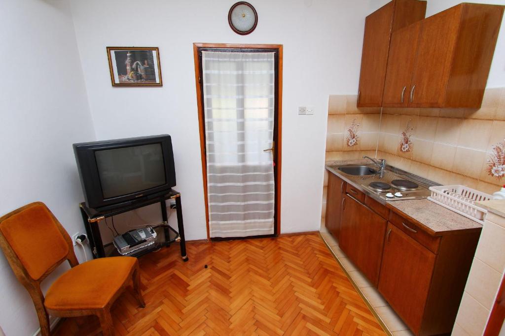 Kuchyň nebo kuchyňský kout v ubytování Apartments Goga