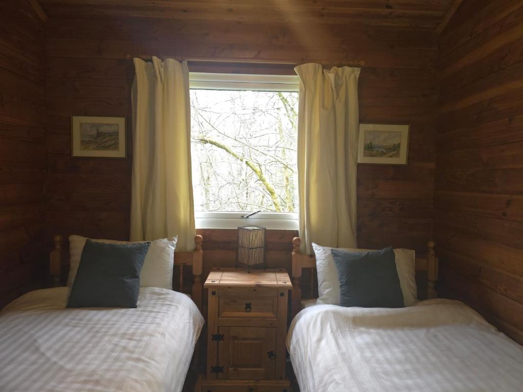 Postel nebo postele na pokoji v ubytování Stravaigin Lodges