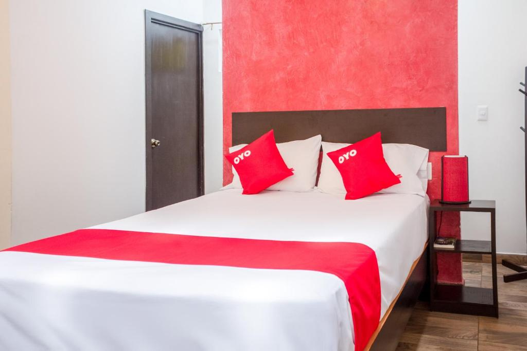 Postel nebo postele na pokoji v ubytování OYO Hotel Gandag