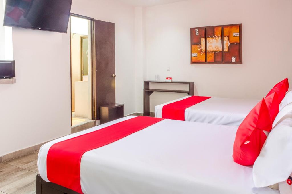 Postel nebo postele na pokoji v ubytování OYO Hotel Gandag