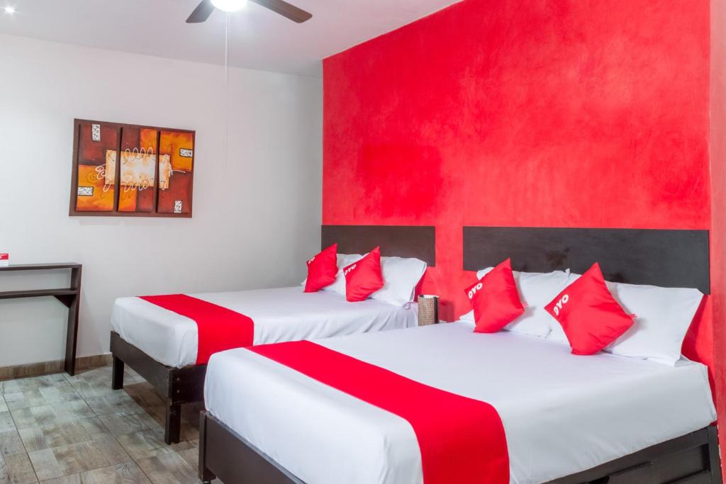 Postel nebo postele na pokoji v ubytování OYO Hotel Gandag