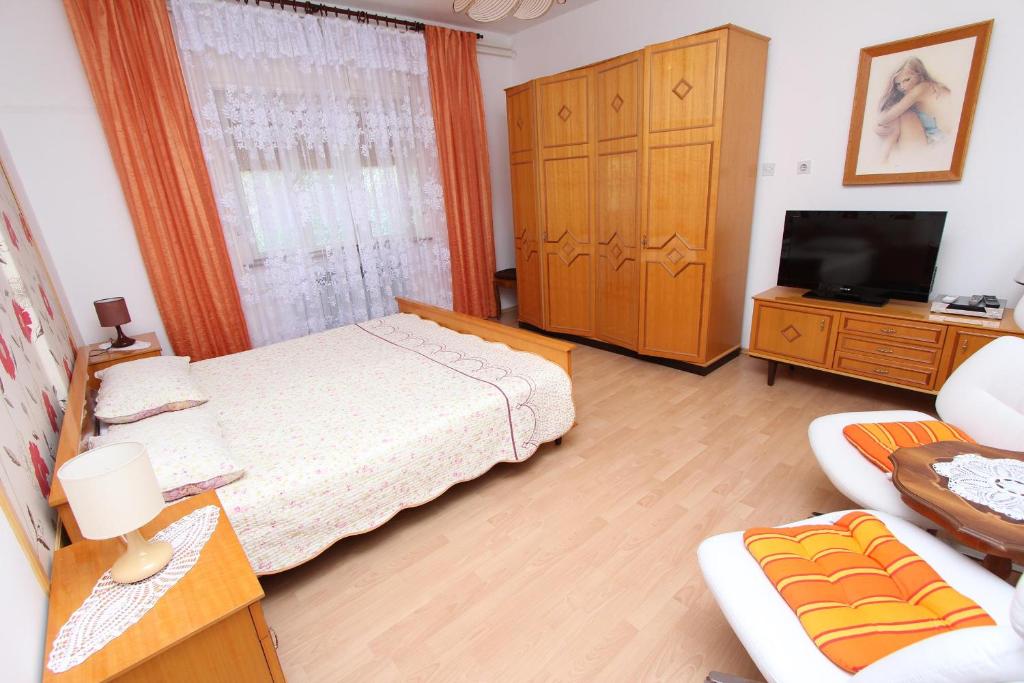 Postel nebo postele na pokoji v ubytování Apartments Goga