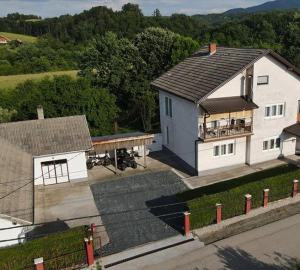 an aerial view of a large white house at Apartmani SIMIĆ in Doboj
