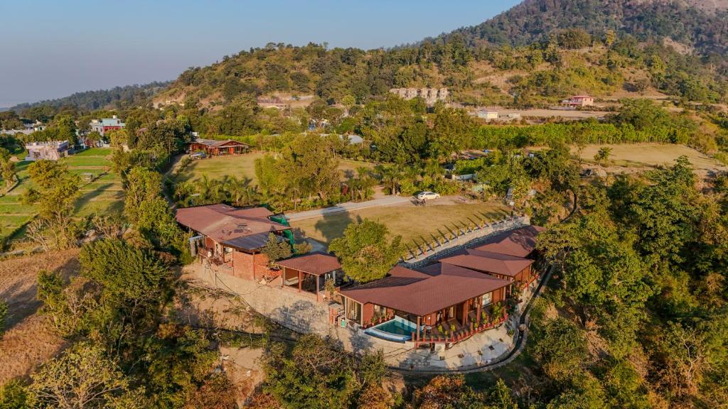 an overhead view of a house on a hill at SaffronStays Timber Quest - Pinewood Cottages in Dehradun