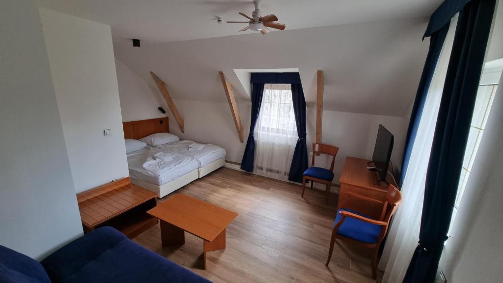 Кровать или кровати в номере Wellness Penzion HORSE FARM