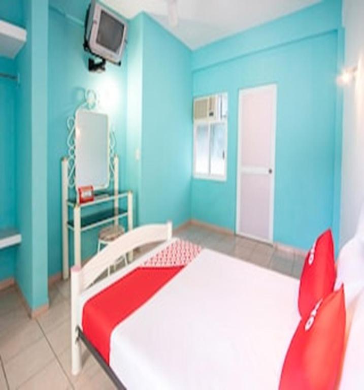Postel nebo postele na pokoji v ubytování OYO Hotel Estacion,José Cardel,Parque Central Revolución