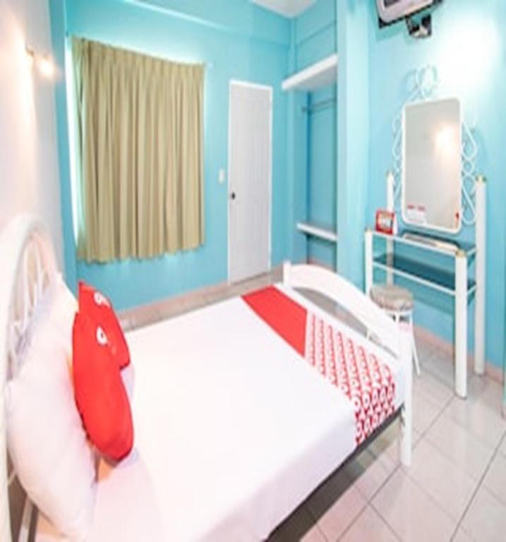 Postel nebo postele na pokoji v ubytování OYO Hotel Estacion,José Cardel,Parque Central Revolución