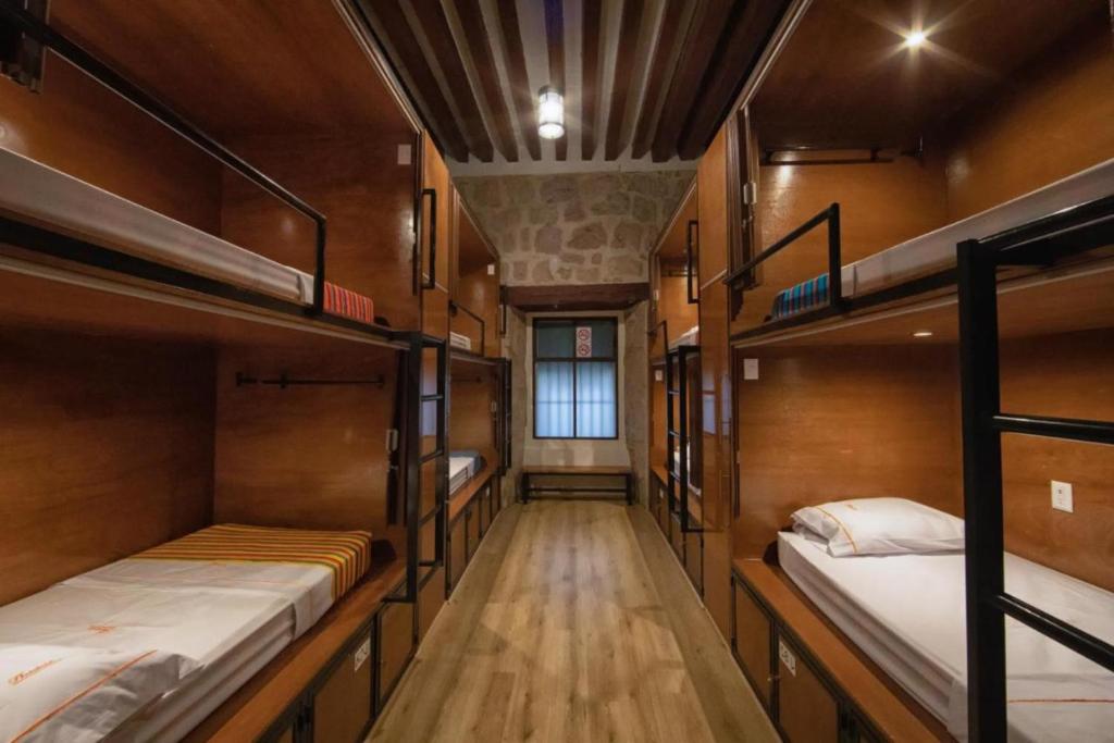 Postel nebo postele na pokoji v ubytování OYO Hostal Mich