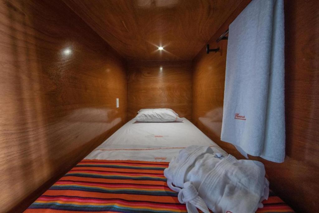 Postel nebo postele na pokoji v ubytování OYO Hostal Mich
