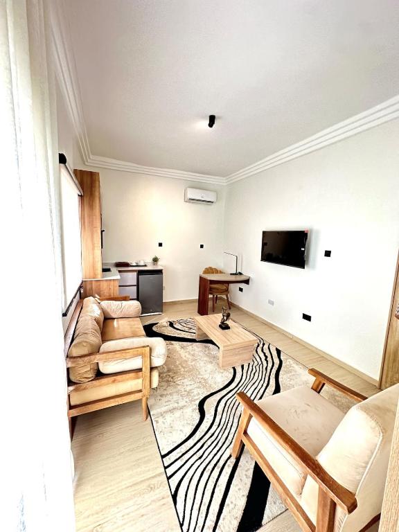 TV a/nebo společenská místnost v ubytování Cozy Cove Residence