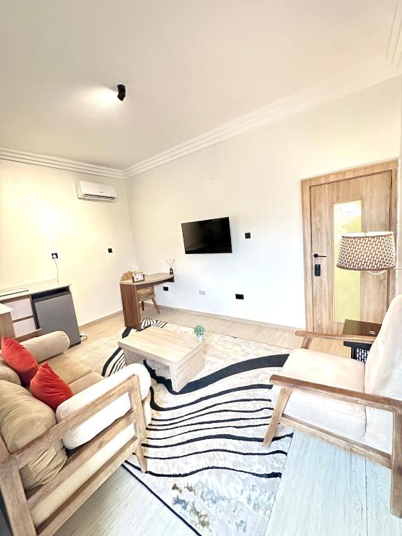 TV a/nebo společenská místnost v ubytování Cozy Cove Residence