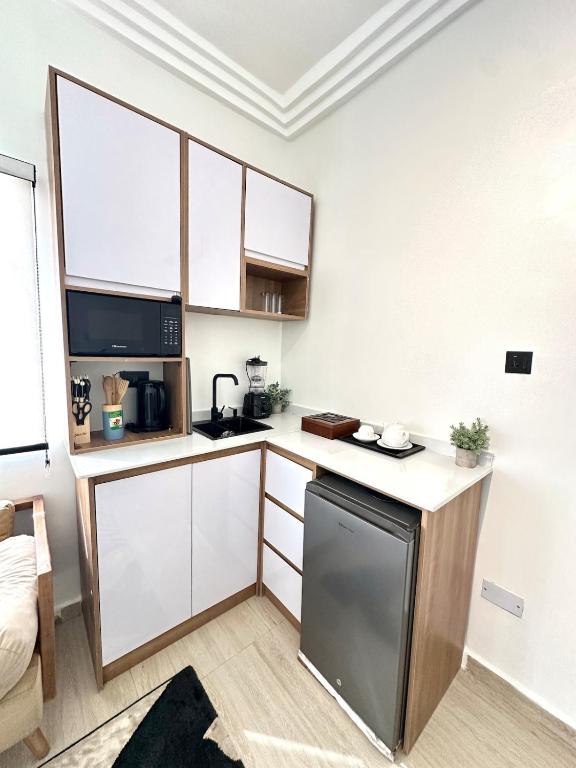 Kuchyň nebo kuchyňský kout v ubytování Cozy Cove Residence