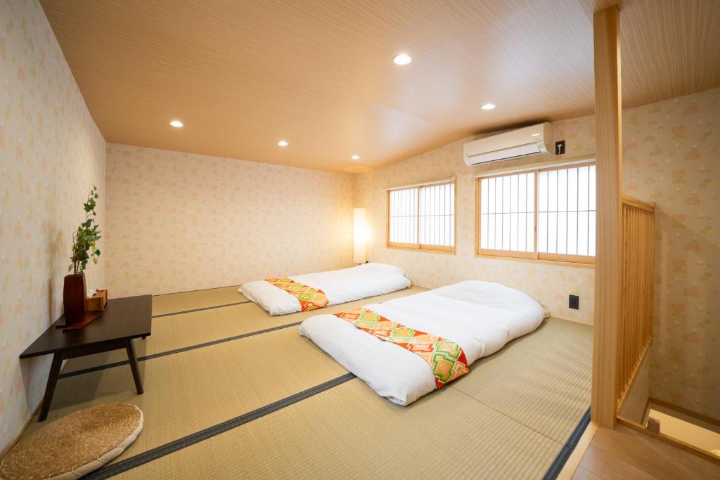 Postel nebo postele na pokoji v ubytování 久宿 東山 Hisaya Higashiyama Room D