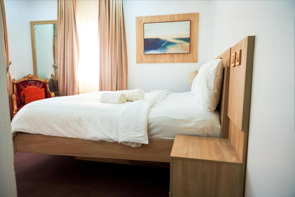Postel nebo postele na pokoji v ubytování Cozy Cove Residence
