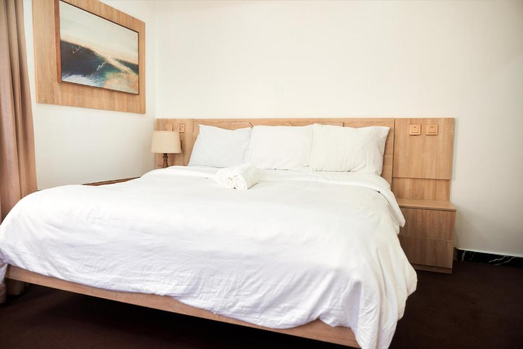 Postel nebo postele na pokoji v ubytování Cozy Cove Residence