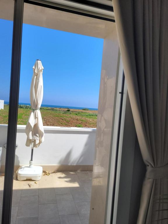 a view of a room with a window and a statue at Cala Paradiso in Monopoli