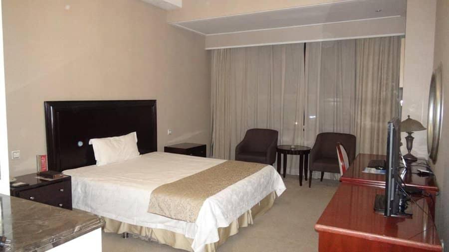 Postel nebo postele na pokoji v ubytování Jades Hotel