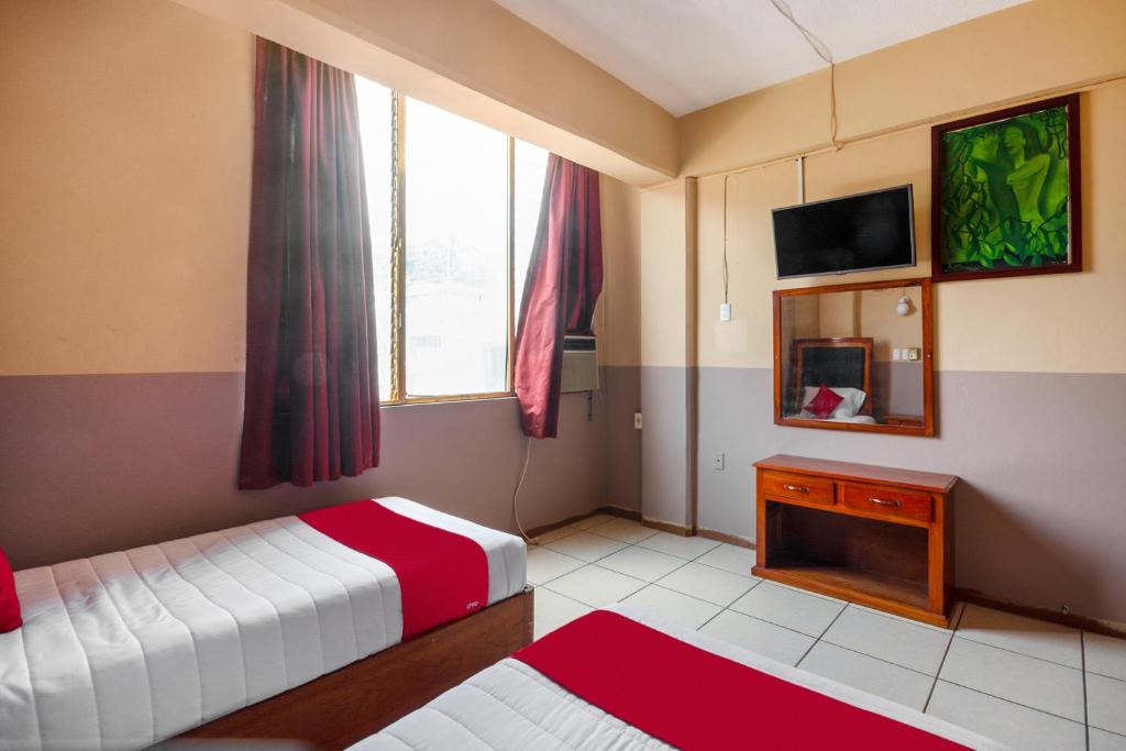Postel nebo postele na pokoji v ubytování OYO Hotel Totonacapan, Papantla