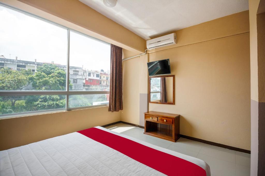 Postel nebo postele na pokoji v ubytování OYO Hotel Totonacapan, Papantla