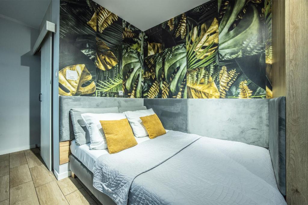Postel nebo postele na pokoji v ubytování WiguryTower Apartaments 63'