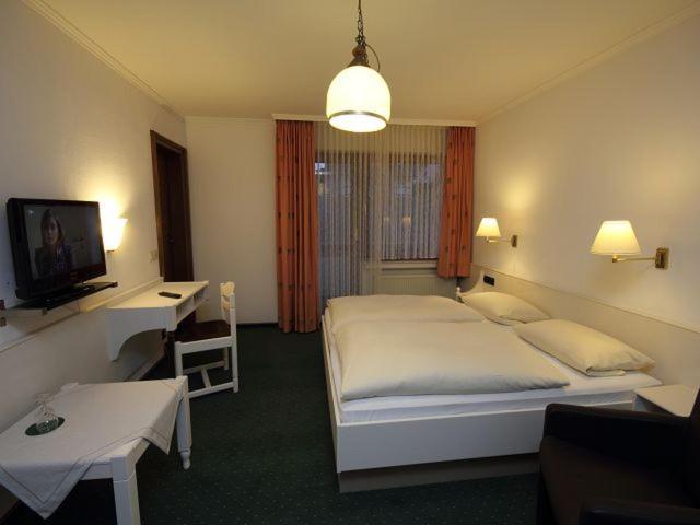 Postel nebo postele na pokoji v ubytování Hotel Bischof