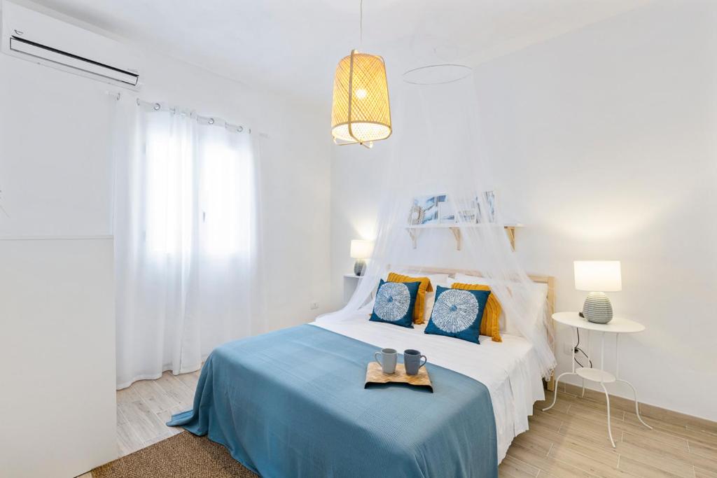 Posteľ alebo postele v izbe v ubytovaní Casa un Tocco di Blu con piscina privata