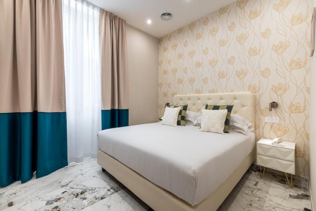 Postel nebo postele na pokoji v ubytování 69 Suite Boutique