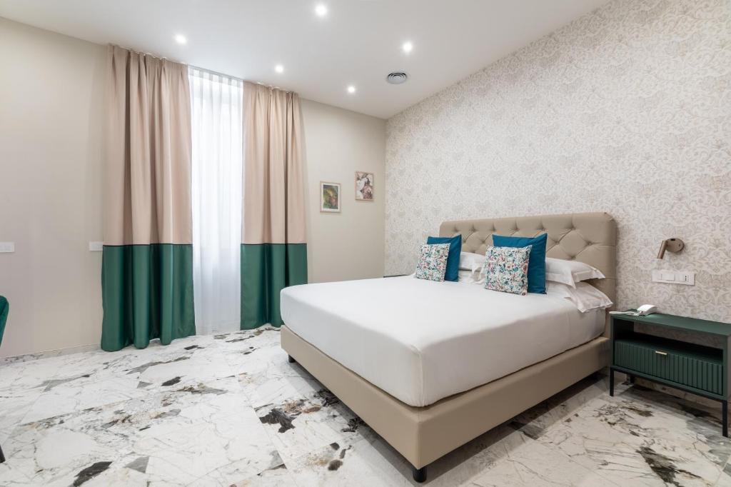 Postel nebo postele na pokoji v ubytování 69 Suite Boutique