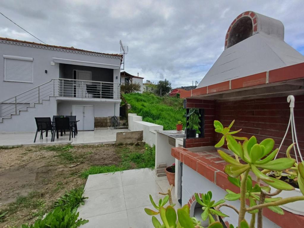 a view of a house with a patio at Angie's House Sykia in Sikia