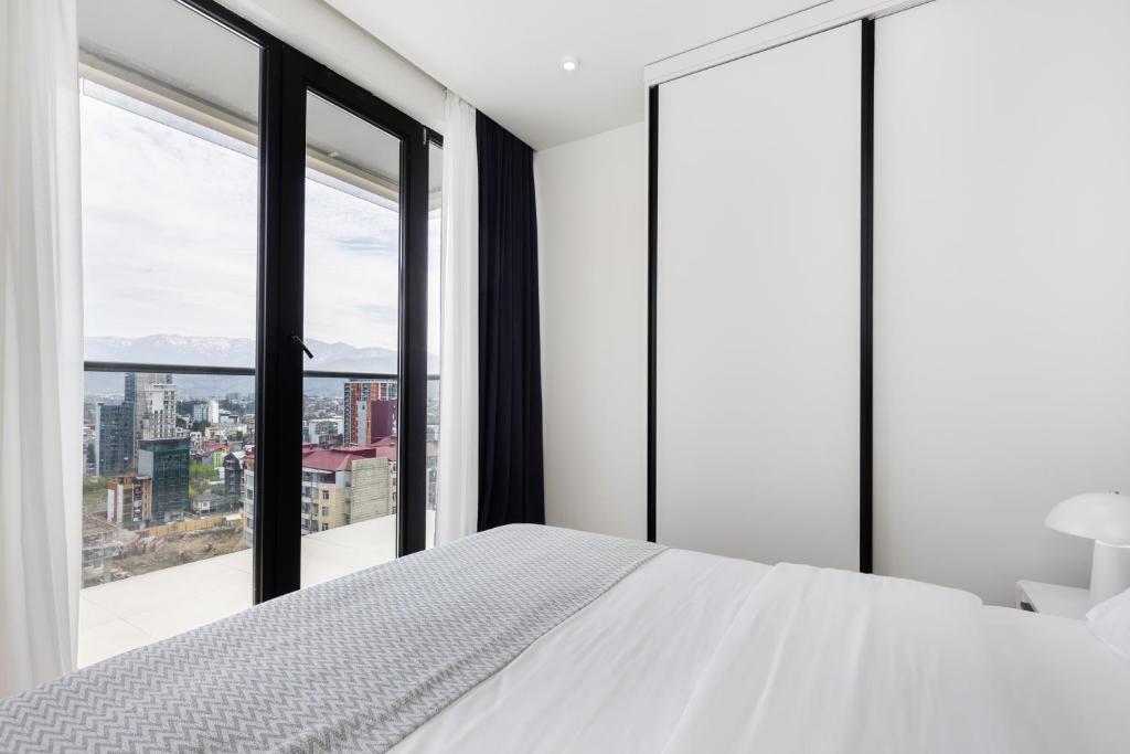 Postel nebo postele na pokoji v ubytování Next Apartments OFFICIAL