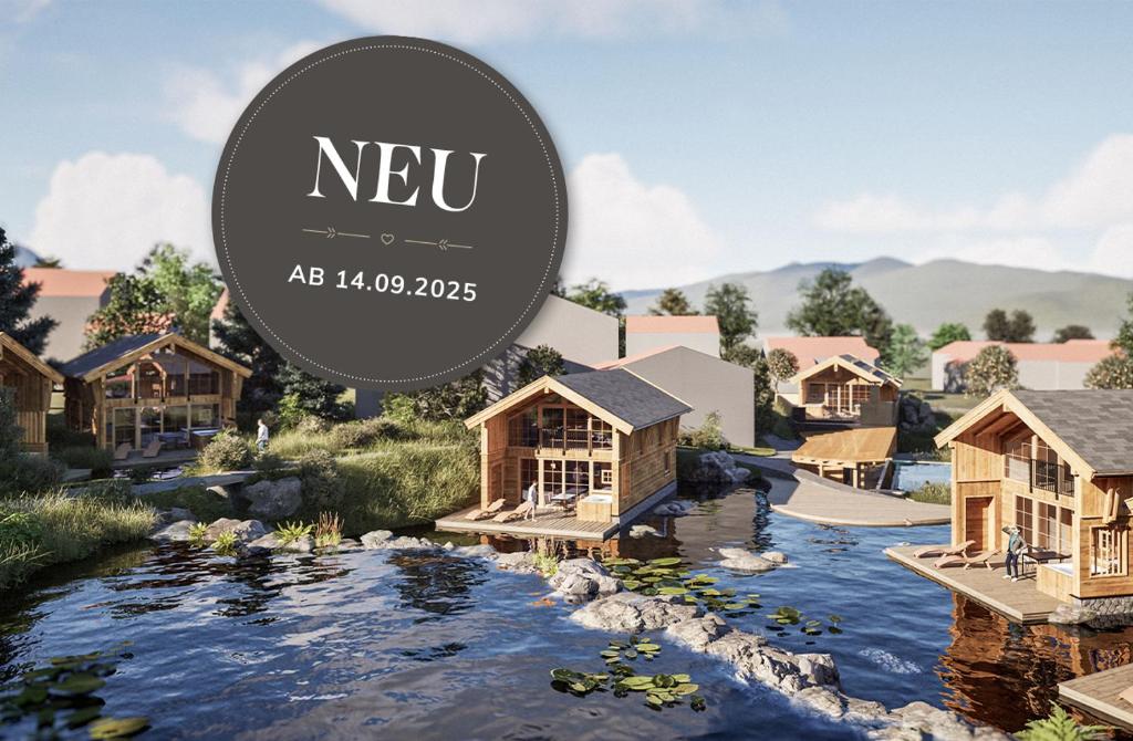 ein Resort mit einem Fluss und Häusern in der Unterkunft Alpzitt-Chalets in Burgberg