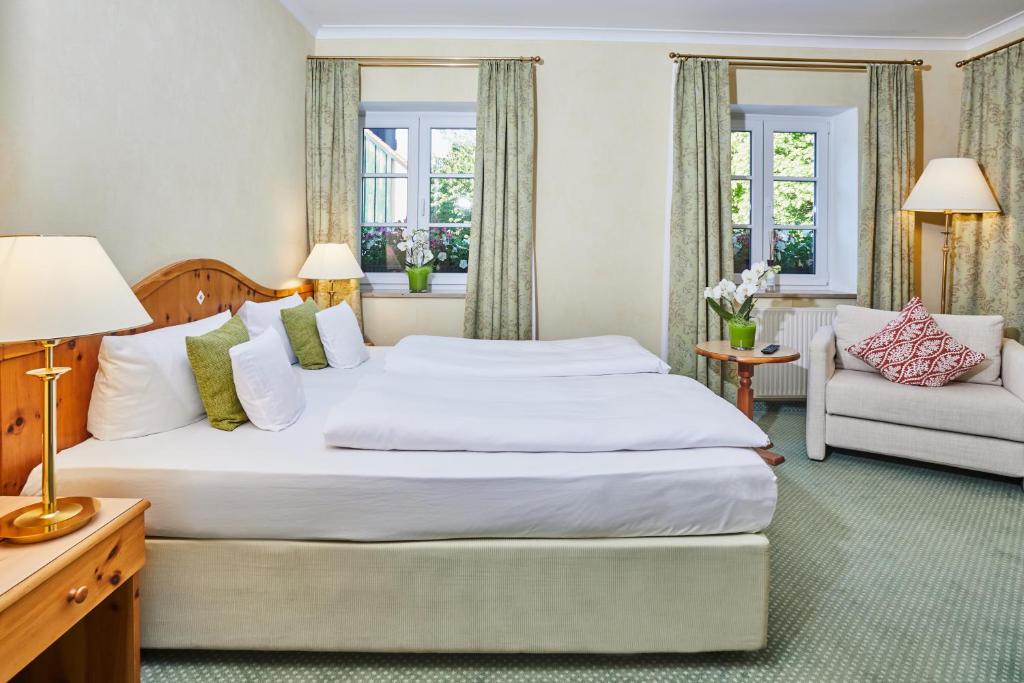 Postel nebo postele na pokoji v ubytování Hotel Freisinger Hof