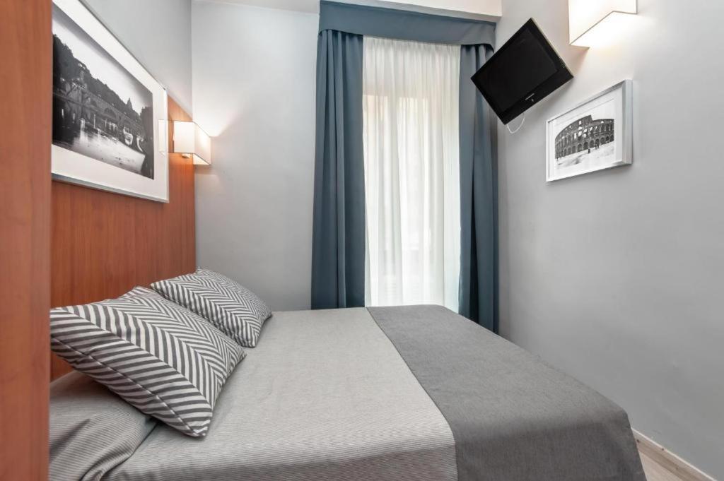Postel nebo postele na pokoji v ubytování Reyes Suite & Rooms