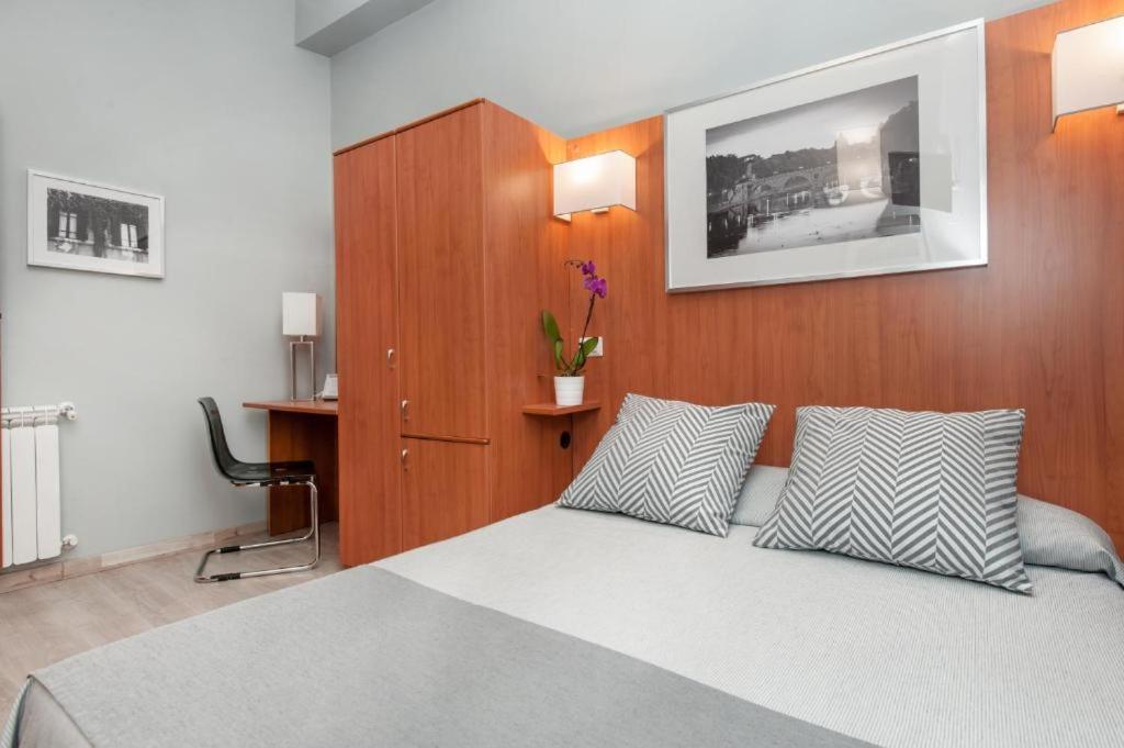 Postel nebo postele na pokoji v ubytování Reyes Suite & Rooms